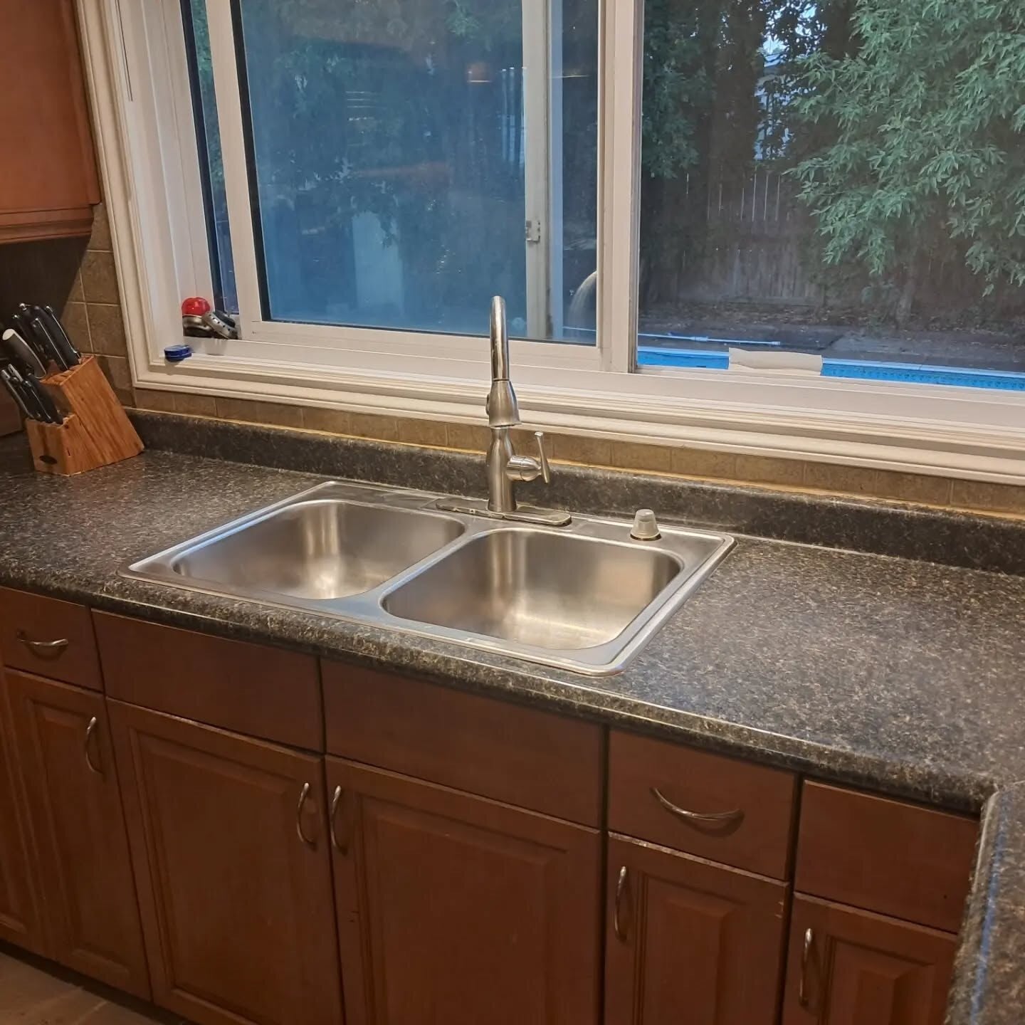 Clean kitchen sink and polished counters